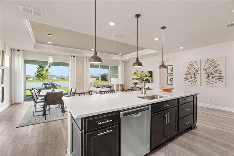 Kitchen and Cafe. Model Home Design. Pictures are for illustrative purposes only. Elevations, colors and options may vary. Furniture is for model home staging only.