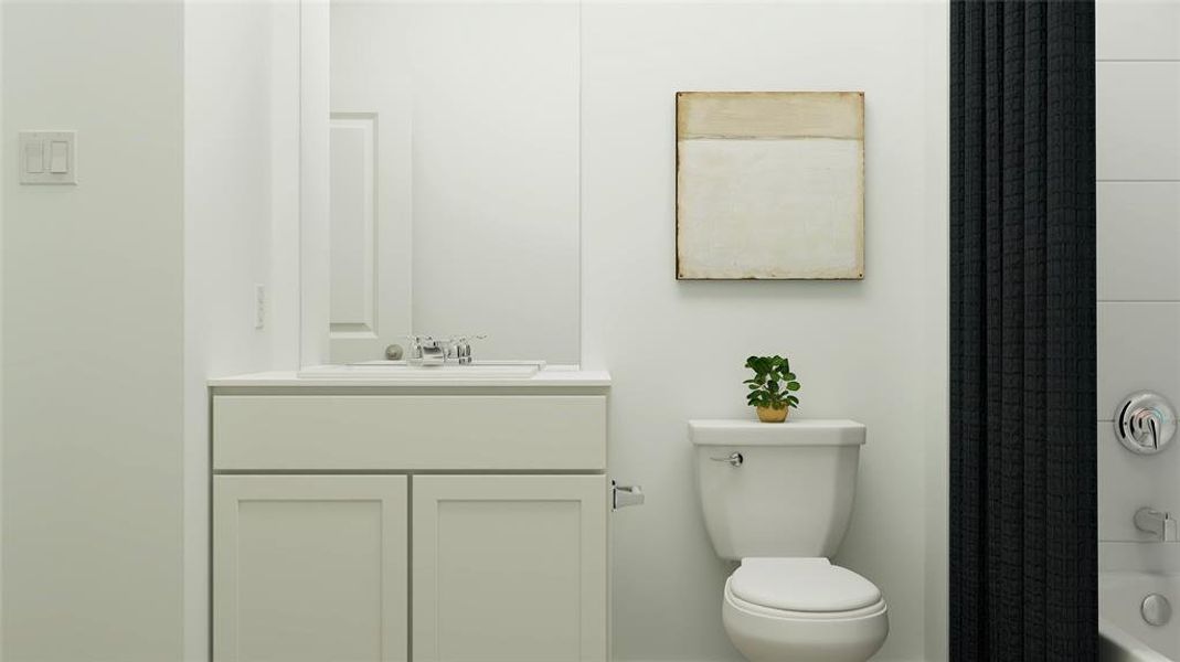 Full bathroom featuring vanity, toilet, and shower / tub combo with curtain