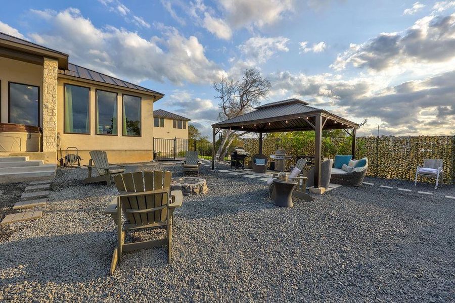 A large area with firepit and gazebo