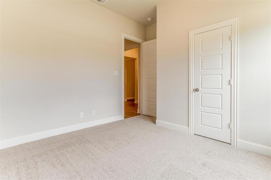 Unfurnished bedroom featuring carpet