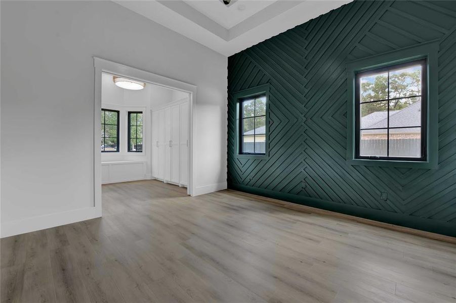 Primary bedroom with accent walls