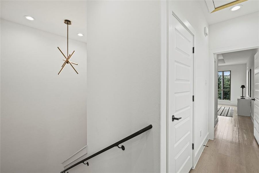 Corridor featuring light hardwood / wood-style floors