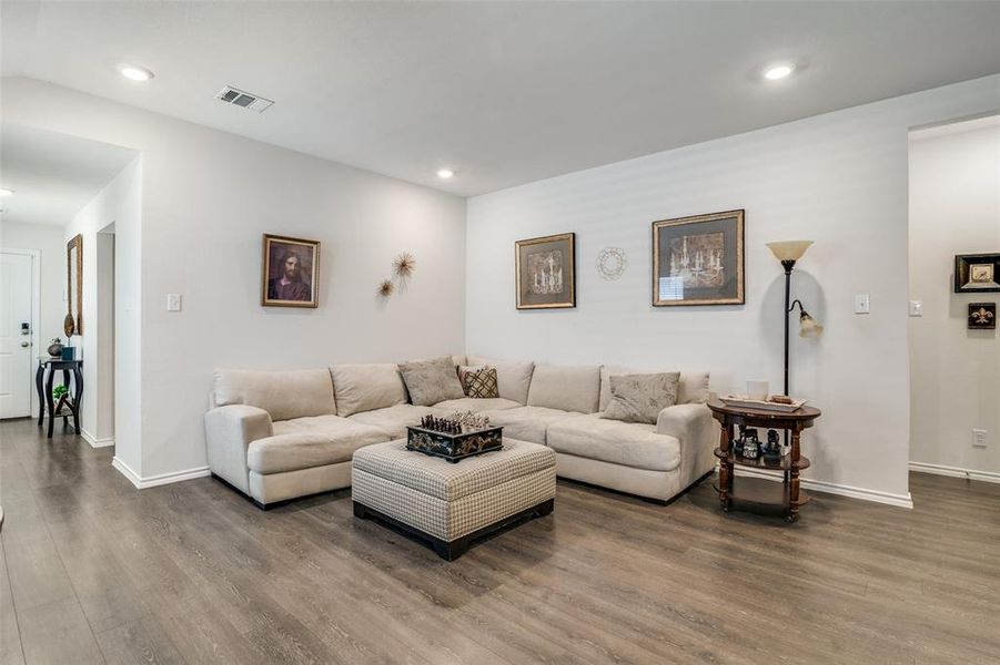 Living room with hardwood / wood-style flooring