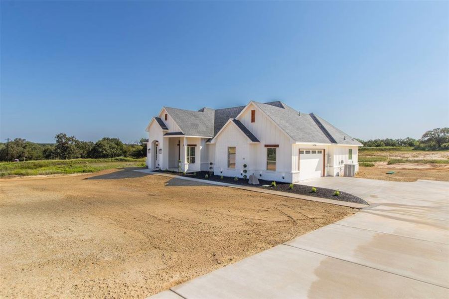 Modern farmhouse featuring central air condition unit