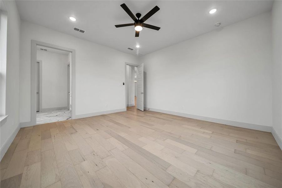 Unfurnished bedroom with light hardwood / wood-style flooring and ceiling fan