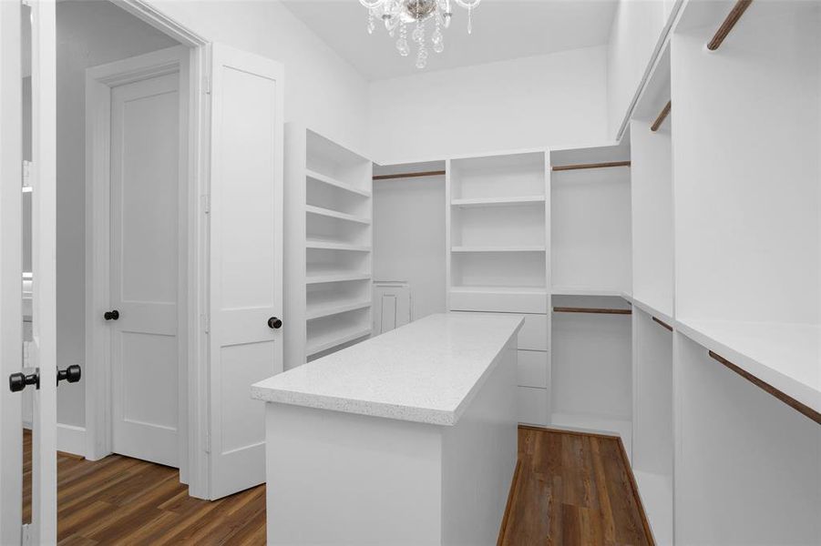 Fantastic primary closet has built-in organizer system.