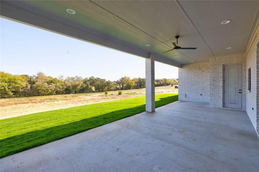 View of patio featuring ceiling fan