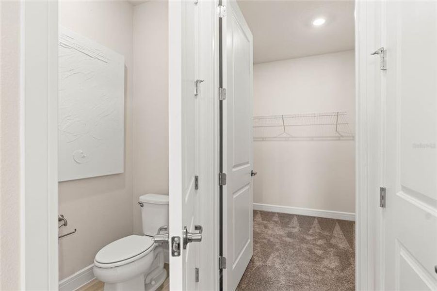 Owner's En Suite Bathroom and Walk-in Closet.  Model Home Design. Pictures are for illustrative purposes only. Elevations, colors and options may vary. Furniture is for model home staging only.