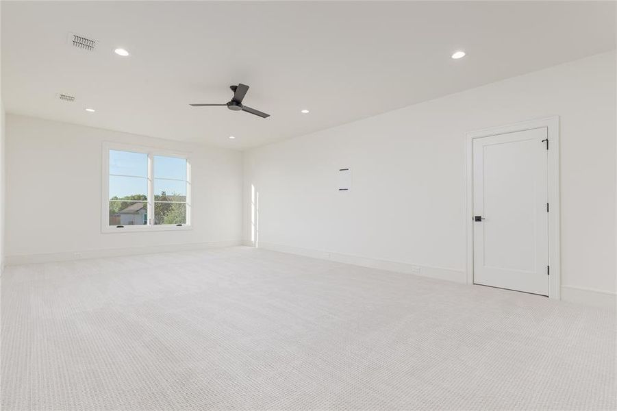 Expansive 2nd floor gameroom with large storage and media closet.