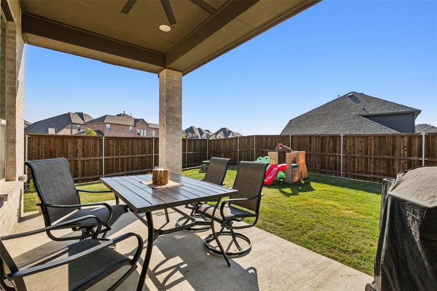 View of  covered patio with can lights and outdoor ceiling fan