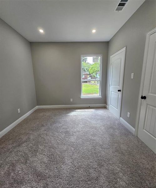 Spare room featuring carpet floors