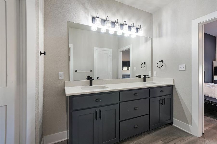 Bathroom featuring vanity and hardwood / wood-style floors