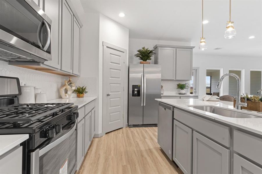 This Gourmet Kitchen will surround you with Stunning Shaker Cabinets, and Beautiful Quartz Countertops!  Open the Beautiful Shaker Panel Door to your Large Walk In Pantry!  Have you made that call yet??  **Image representative of plan only and may vary as built**NEW Photos coming soon!