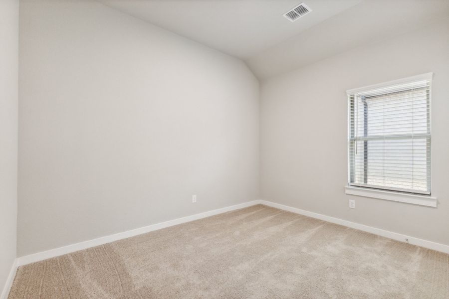 Bedroom in the Pecan home plan by Trophy Signature Homes – REPRESENTATIVE PHOTO