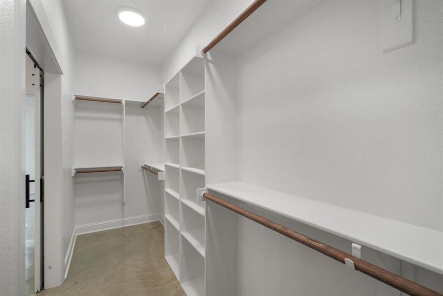 Walk in closet featuring light carpet