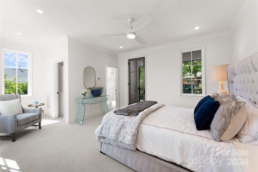 Lovely rear bedroom has windows on 3 sides, walk-in closet, private screened porch and en suite bath