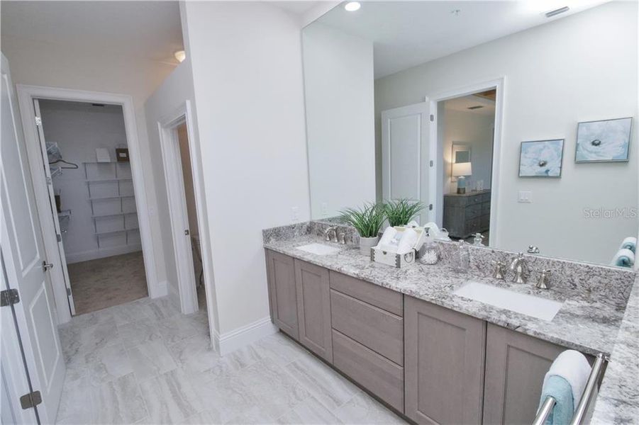 Owner's Ensuite Pictures are of builder’s model, actual townhome may differ in elevation and options.