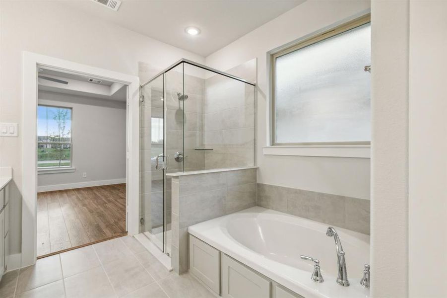 Bathroom with vanity, wood-type flooring, and independent shower and bath