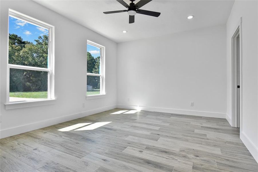 Large master bedroom with lots of natural light