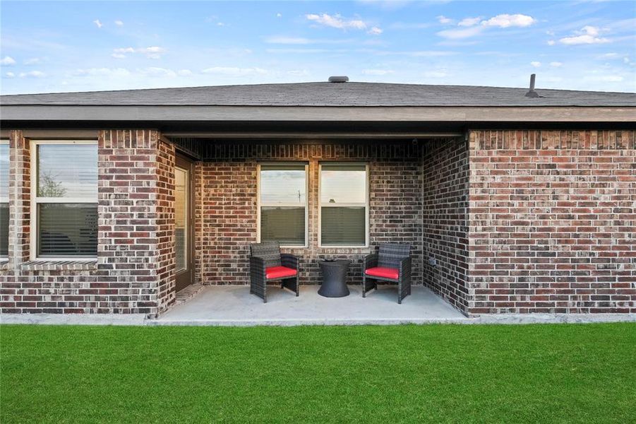 Covered back patio overlooking your oversized backyard