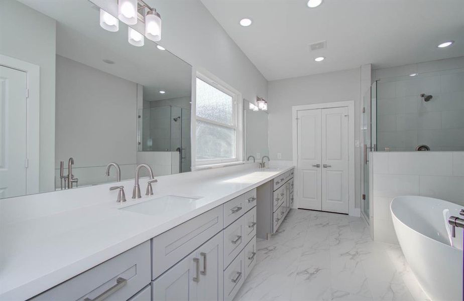 From striking white porcelain floors to stunning dual sinks