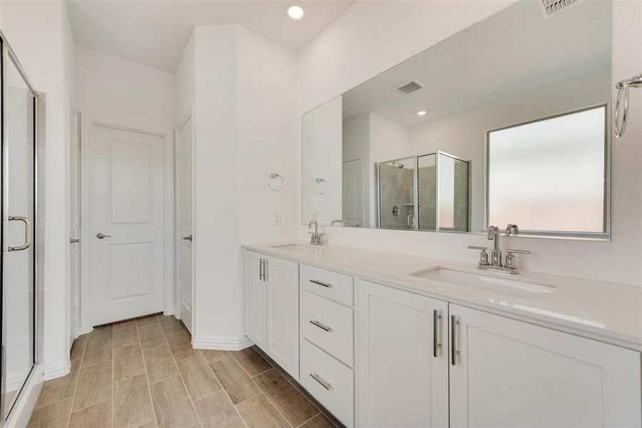 Bathroom with walk in shower and vanity