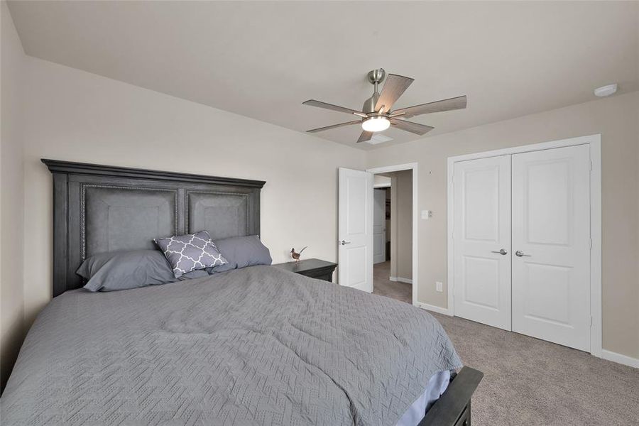 One of three generously sized secondary bedrooms.  Notice the newly installed ceiling fan in this room.