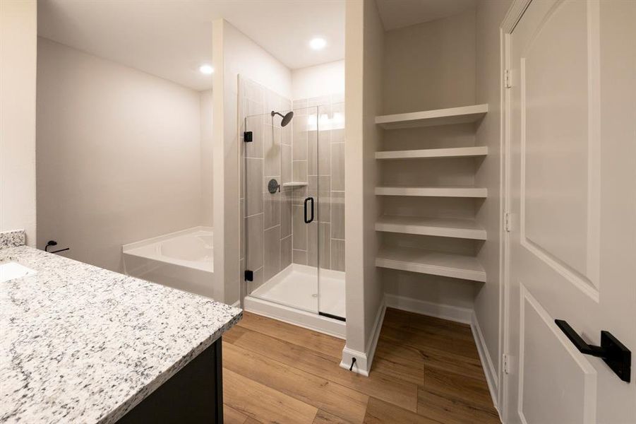 Check out the upgraded glass shower and low profile but elegant storage for towels and toiletries.