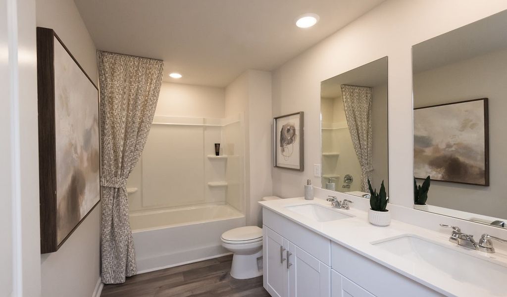 Dual sinks in the secondary bedroom will make mornings a breeze.