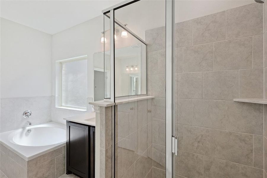 Bathroom with plus walk in shower and vanity