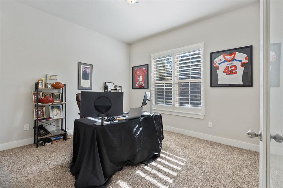 Study with french doors, right off the entry.