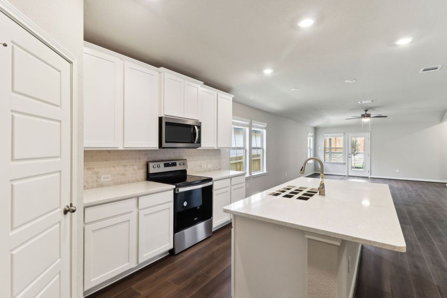 Kitchen in the Hughes floorplan at a Meritage Homes community.