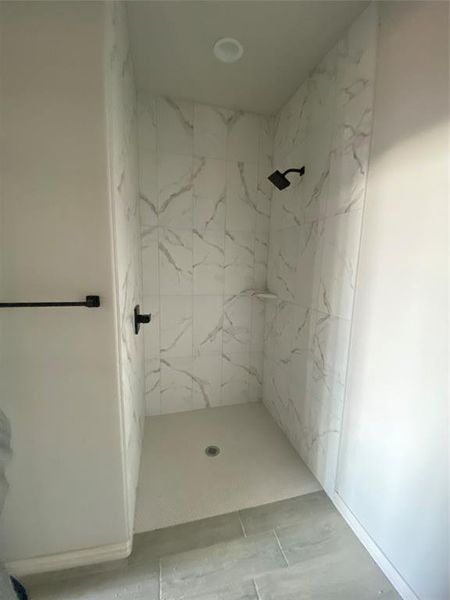 Bathroom featuring tiled shower