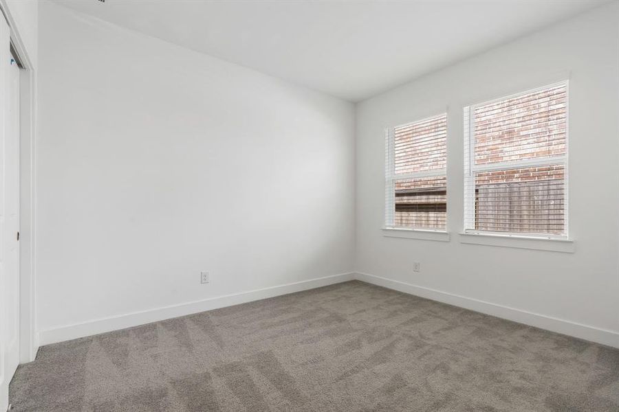 One of two secondary bedrooms.