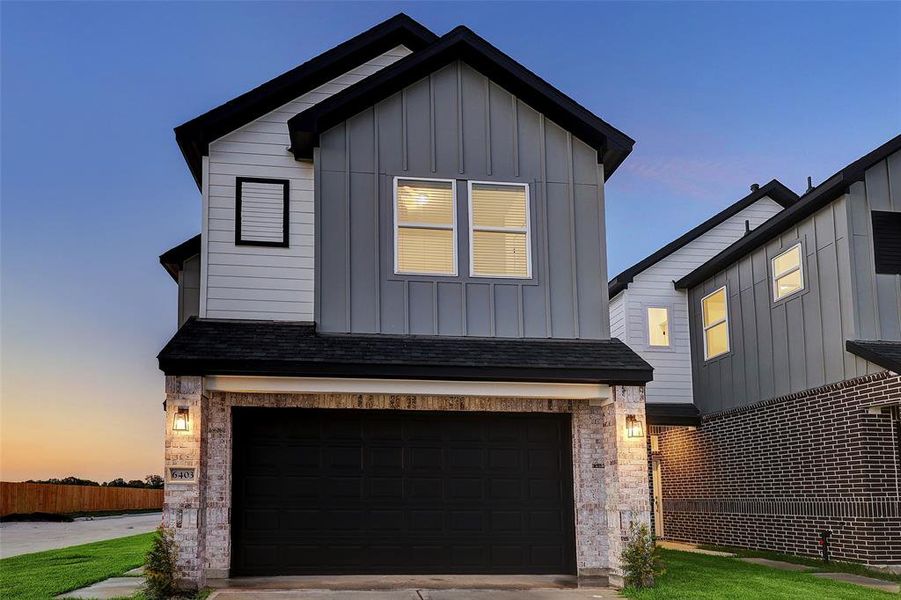 This home is in the final construction stage. Please visit our model home at 6410 Leopold Star Lane to see the builder's standard finishes. Effortlessly traditional and design-forward, this 2 story retreat intertwines classic brick textures with sleek elements. Photos reflect similar finishes from the same builder