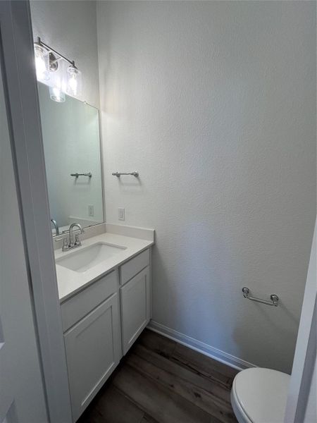 Powder room on main with quartz countertops