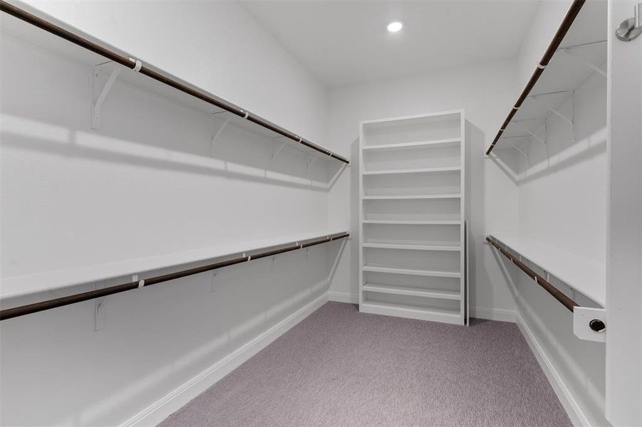 walk in closet in primary bedroom