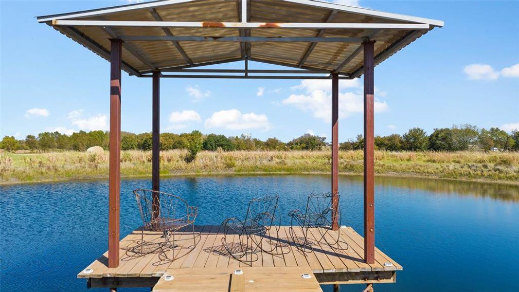 Dock area featuring a water view