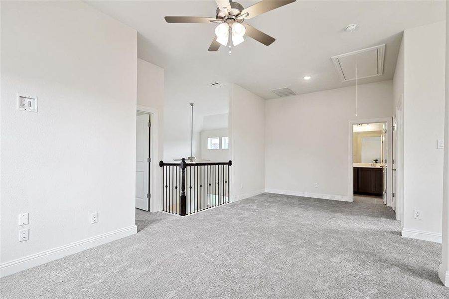 Unfurnished room with ceiling fan and light colored carpet