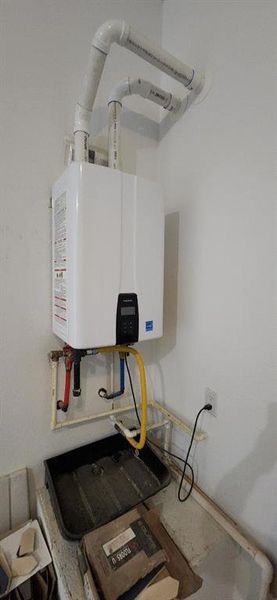 Utilities featuring tankless water heater