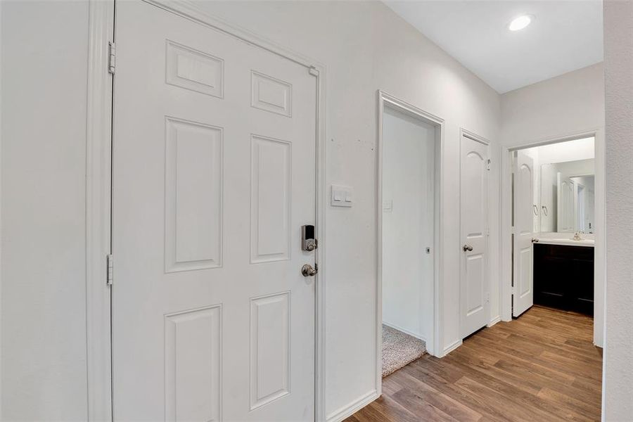 The second door from the left leads to one of three secondary bedrooms. The secondary bath is right next to the bedroom. There is an additional closet for storing your linens next to the bath.