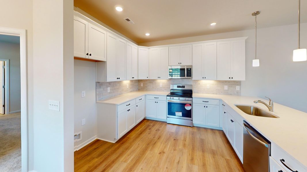 Open plan features chef-inspired kitchen perfect for low maintenance living and entertaining!