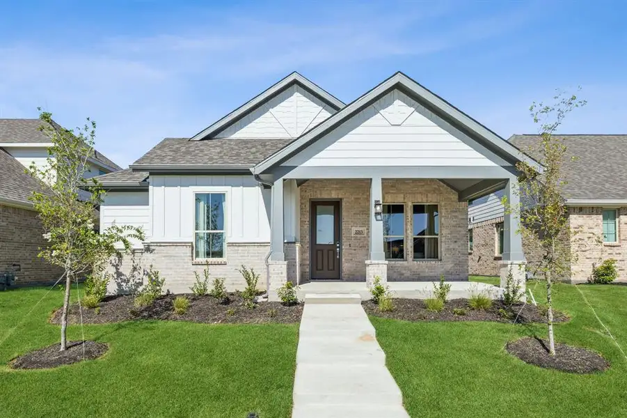 Craftsman-style home featuring a porch and a front lawn