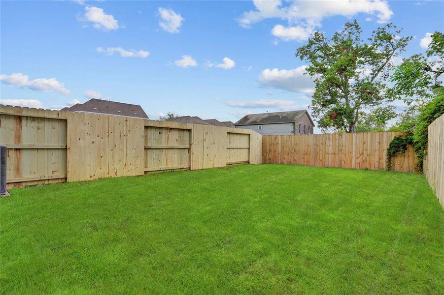 The spacious 24x40 SF back yard has endless possibilities. Excellent sun exposure for fruit trees or gardening!