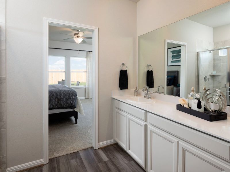 Plenty of counter space and an oversized shower in this luxurious primary bathroom.