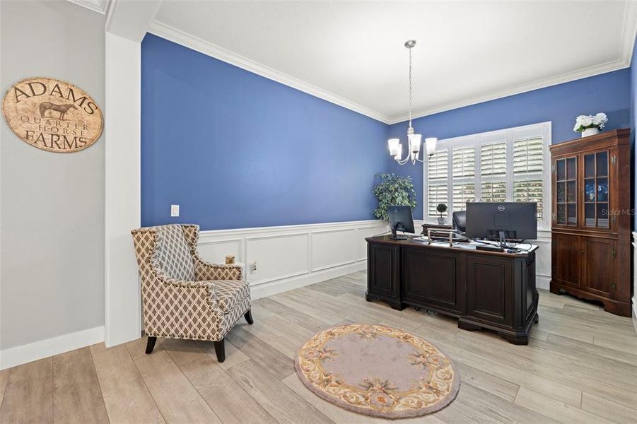 Large Den/Formal Dining Room with Custom Wainscotting & Plantation Shutters.