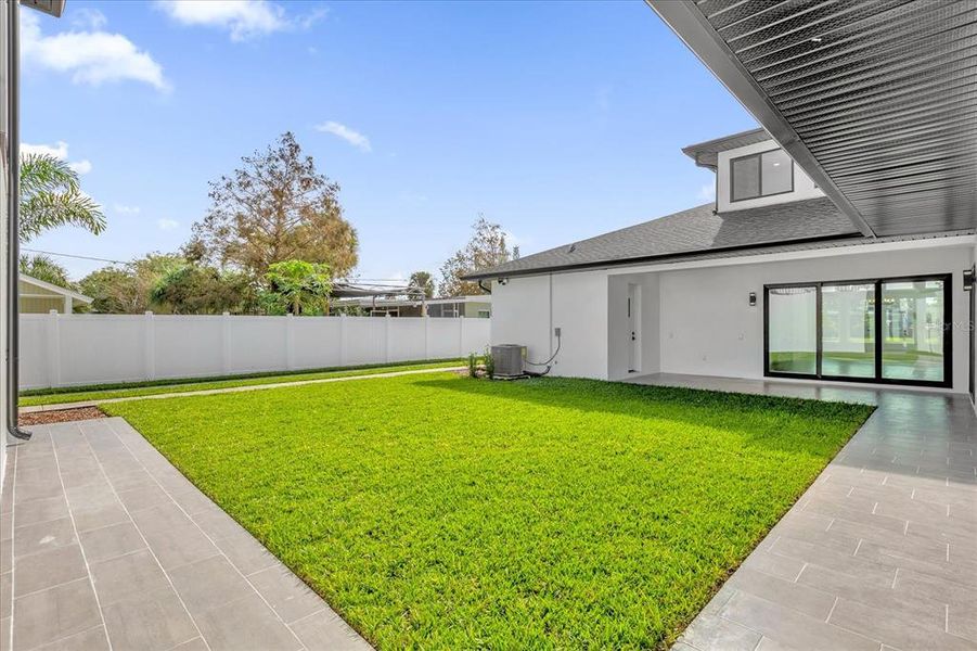 Back yard has plenty of space for a playground or pool!