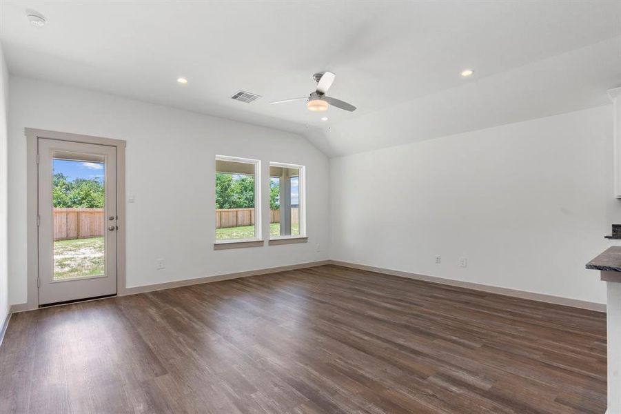 Flowing from the Gorgeous Carefree Large Wood Vinyl Floors, the Open Family Area boasts Walls of Windows overlooking your Spectacular Covered Patio and Backyard! **Image Representative of Plan Only and May Vary as Built**