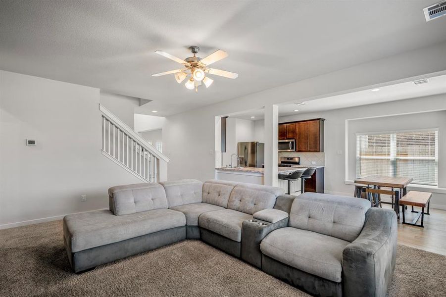 Gather the family and guests together in your huge living room! Featuring an open layout, ceiling fan, and plush carpet.
