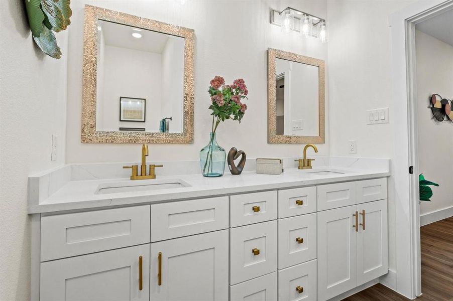 Bathroom featuring vanity and hardwood / wood-style floors